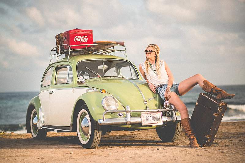 fashion shot of a woman in front of a volkswagen car for a fashion blog