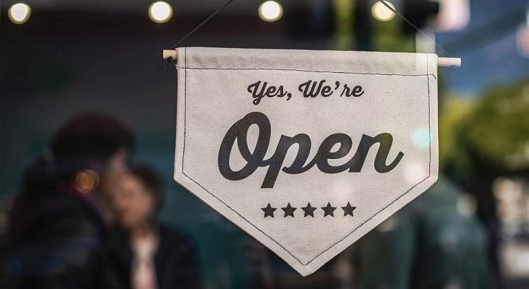 signage reads open written in front of shop as websites are always open for business