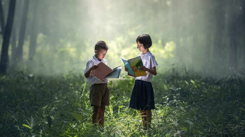 asian children read books countryside field